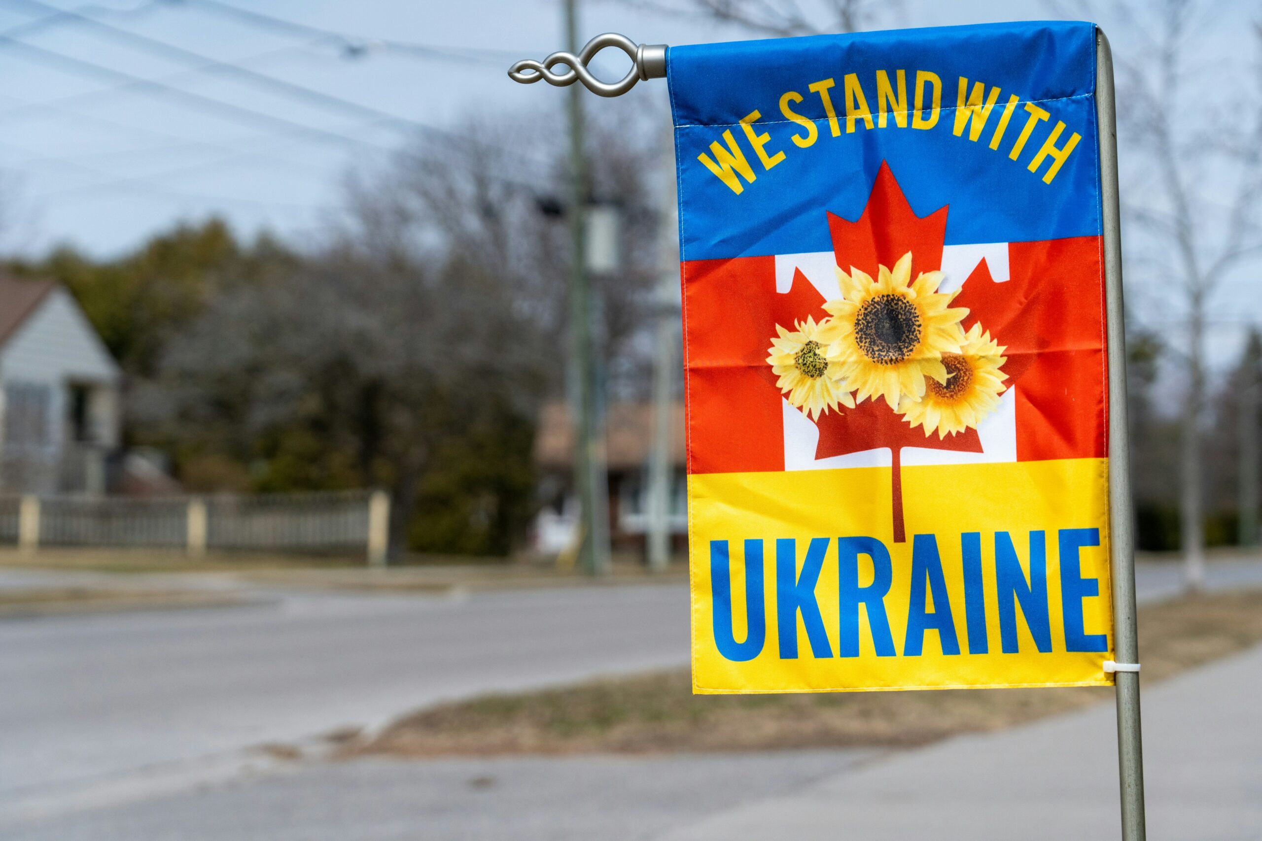 banner saying "We Stand With Ukraine"